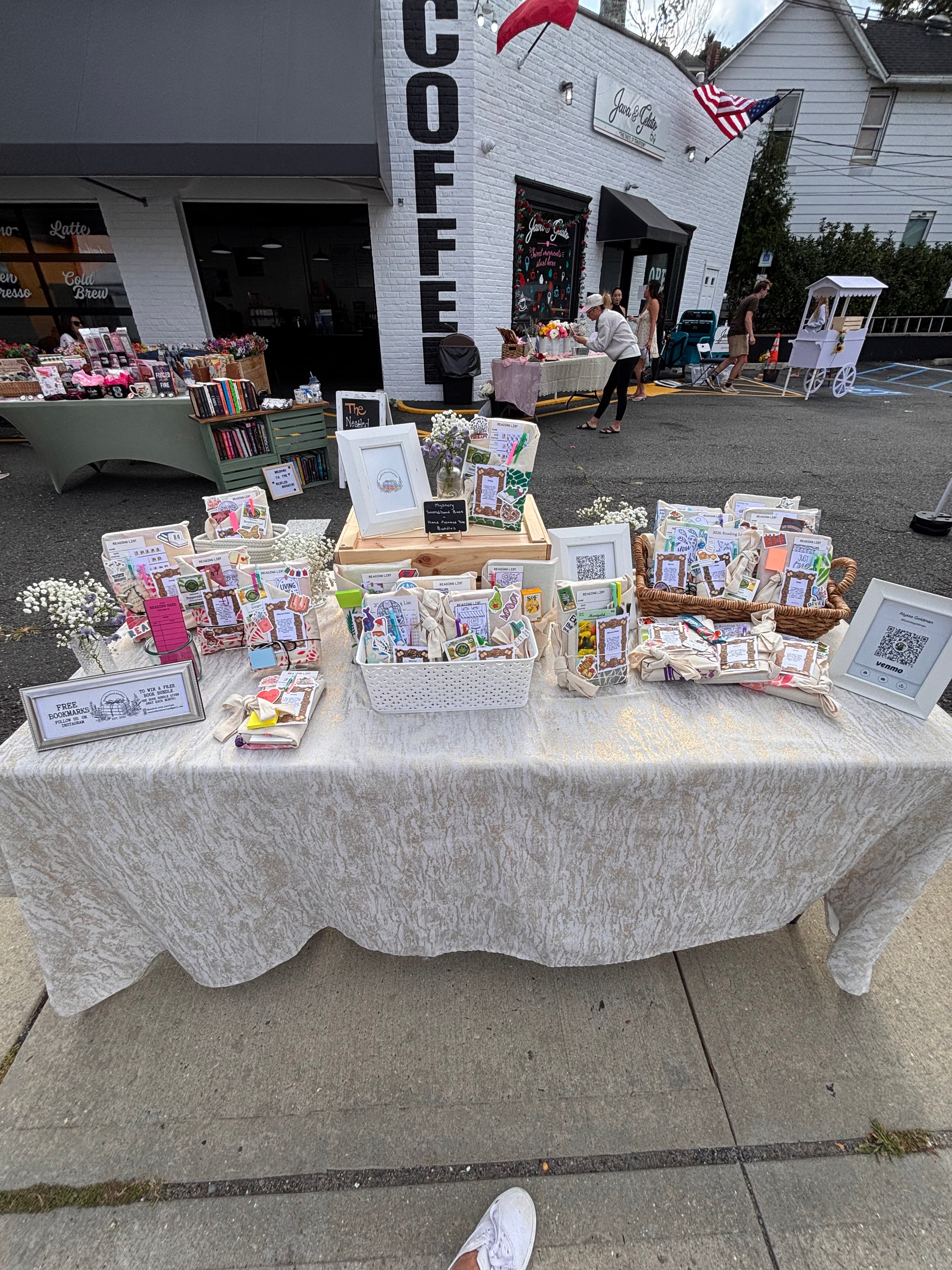 The market table set up outside a coffee shop